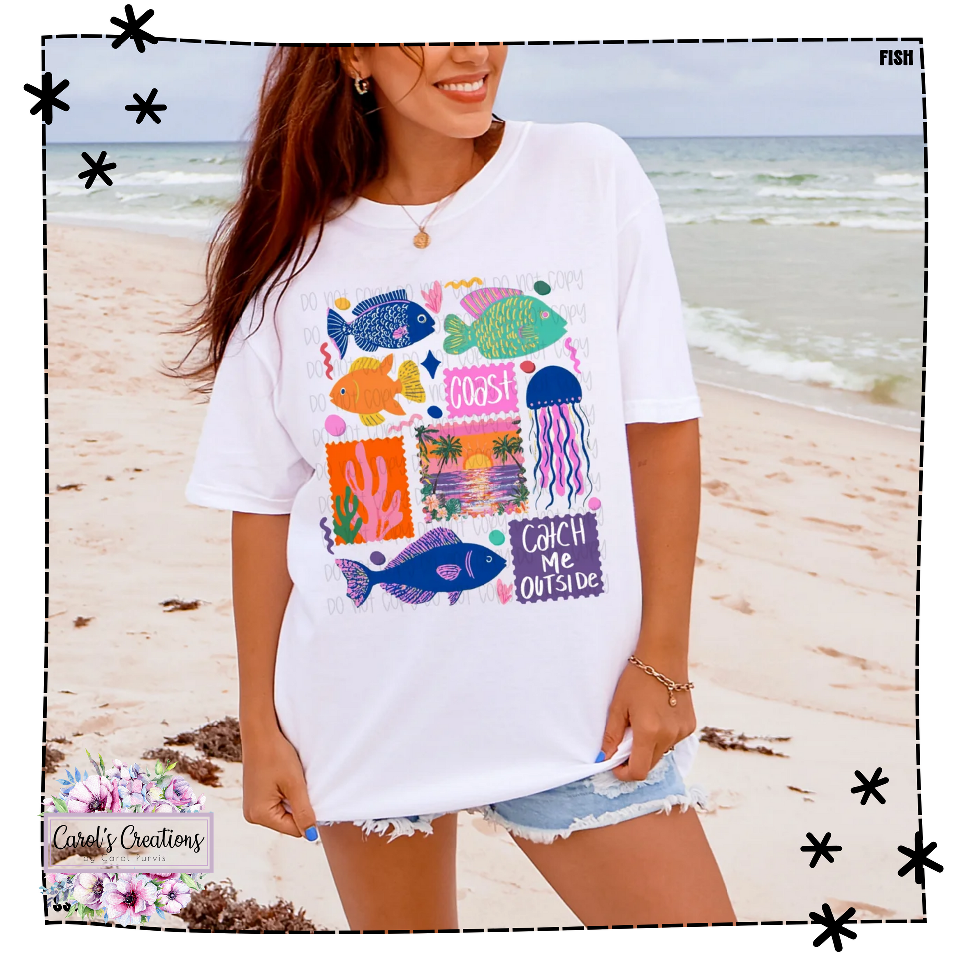 Woman wearing a white t-shirt with colorful fish graphics on a beach.