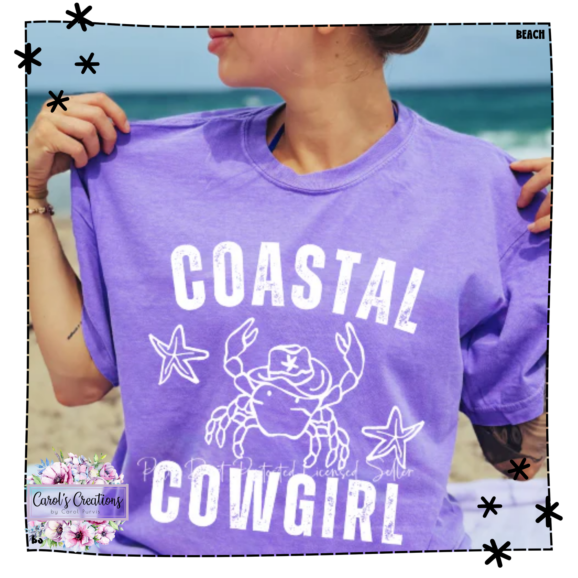 Person wearing a purple t-shirt with 'Coastal Cowgirl' design on a beach.