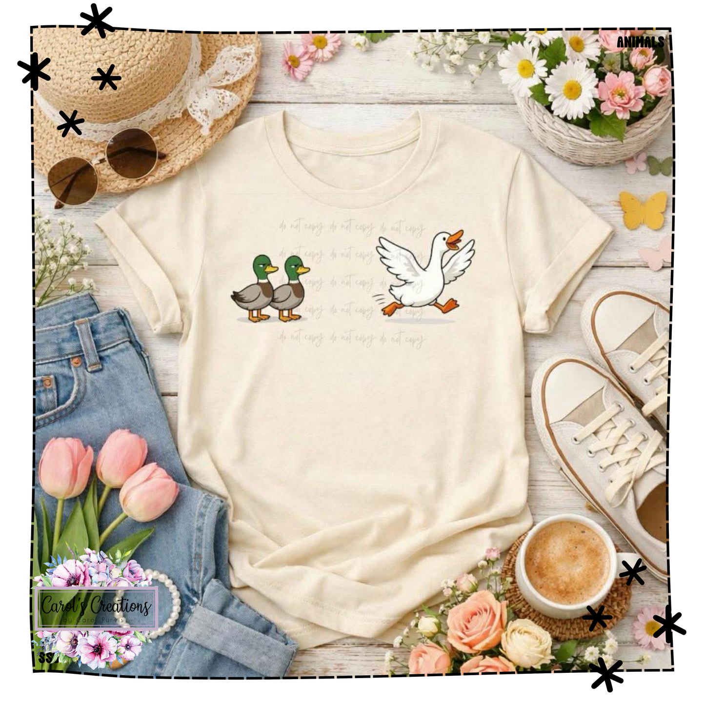 Beige t-shirt with duck designs on a wooden surface with flowers and shoes.