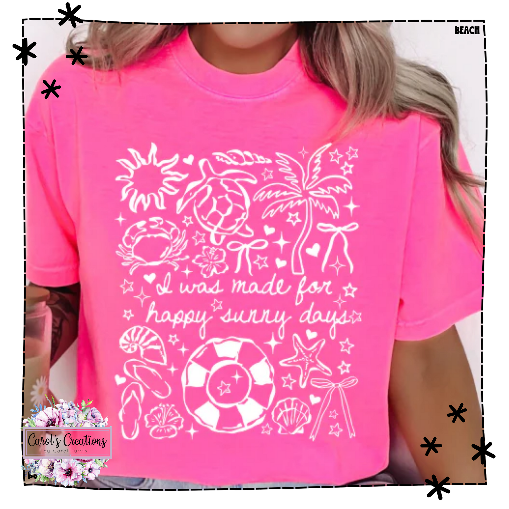 Person wearing a pink t-shirt with beach-themed designs and text.